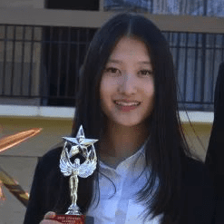 vda student rina song holding Stanford debate trophy